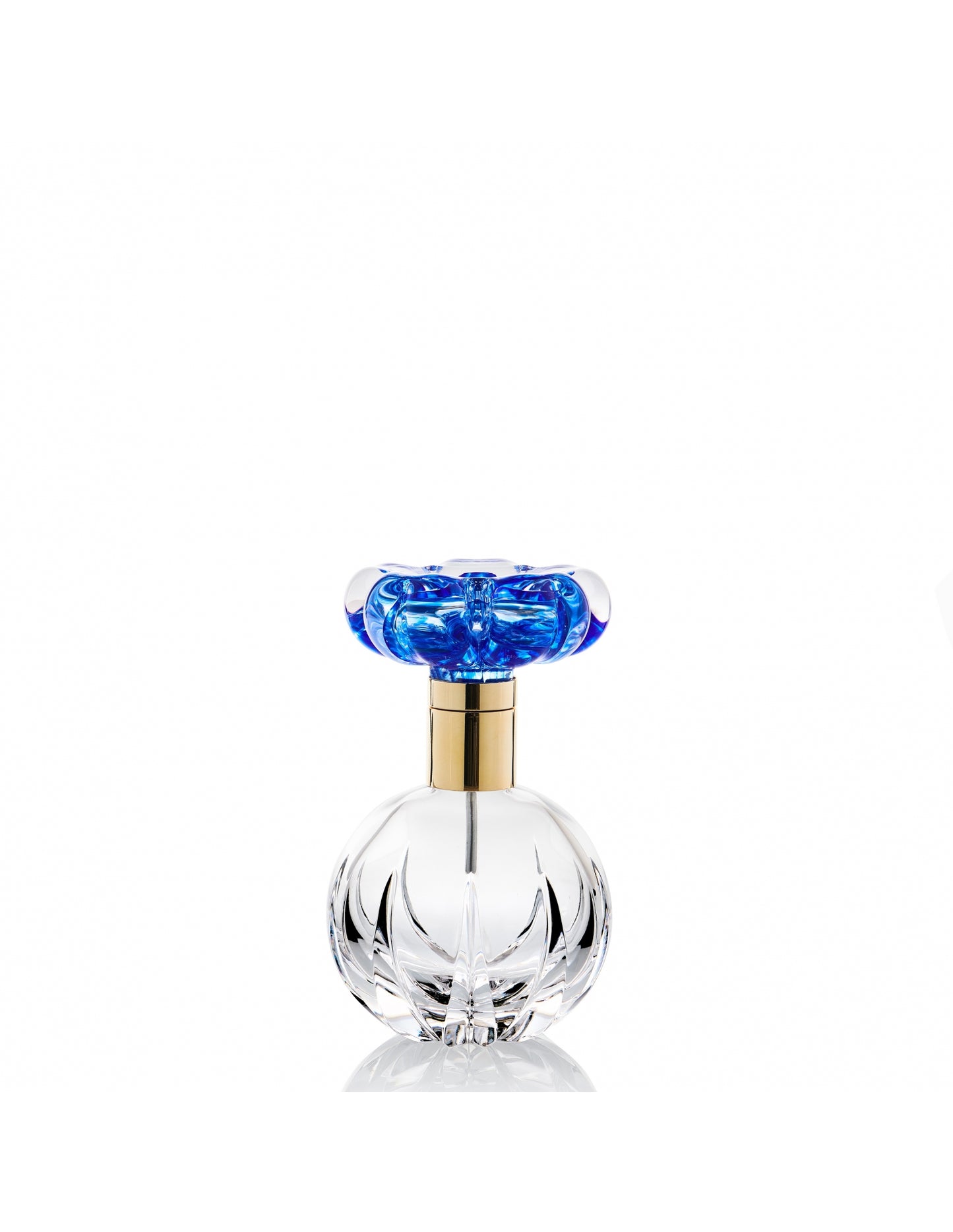 Clear perfume bottle w/ blue flower and gold metal